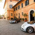 two bugatti veyrons at a mansion