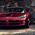dodge viper parked at a stone wall