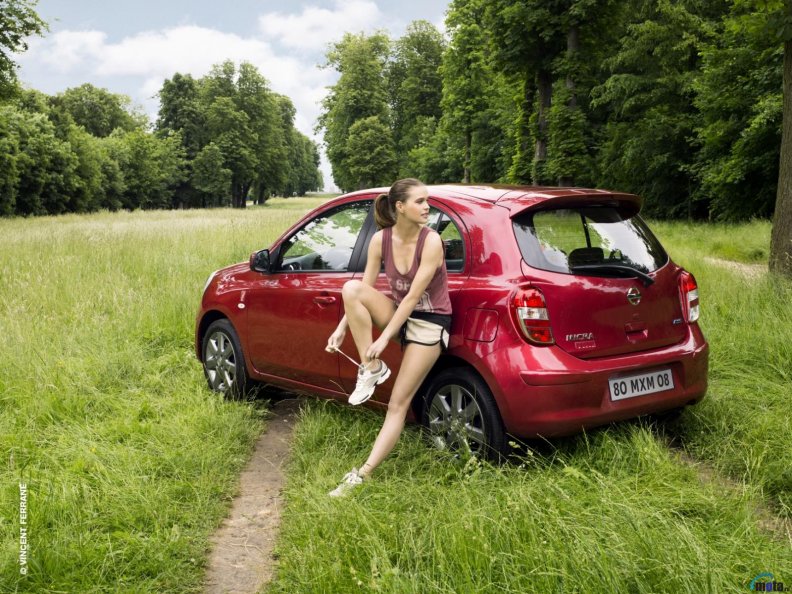Nissan Micra with a girl on the way