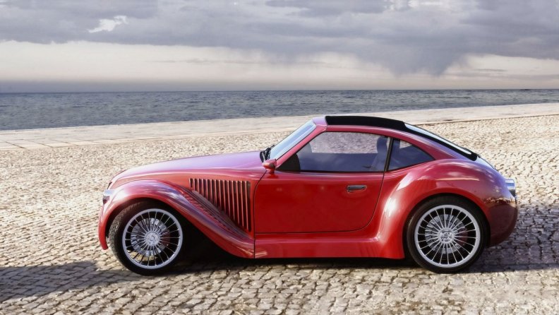 old_red_car_in_the_beach.jpg