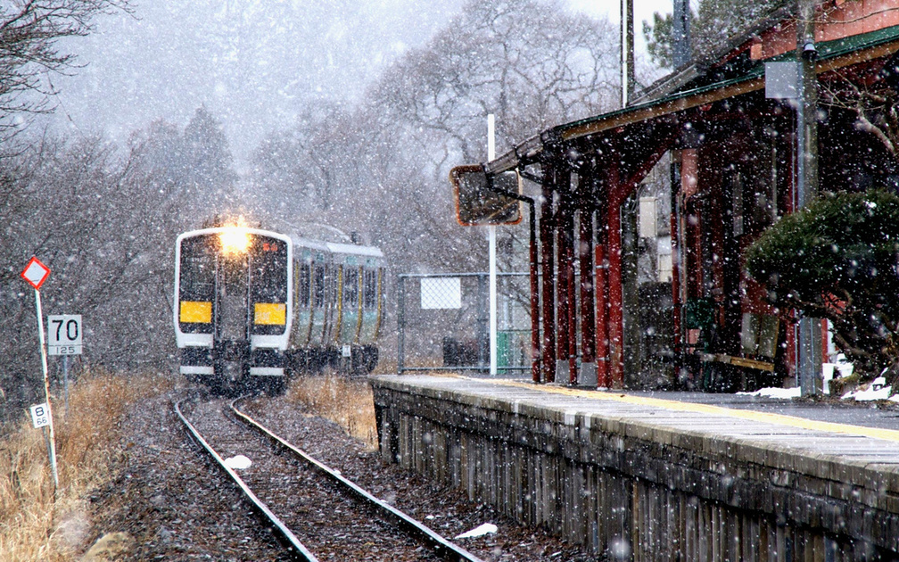 commuter train arriving in winter