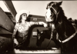 rodeo cowgirl with horse