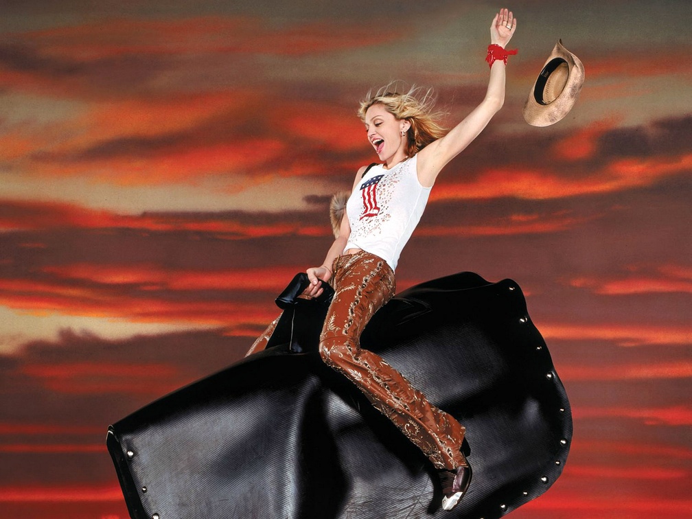 Madonna riding a Mechanical Bull
