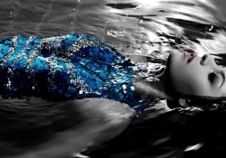 Woman lying in water