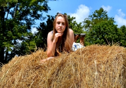 Cowgirl On A Hay Stack