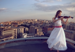 Playing Violin on a roof