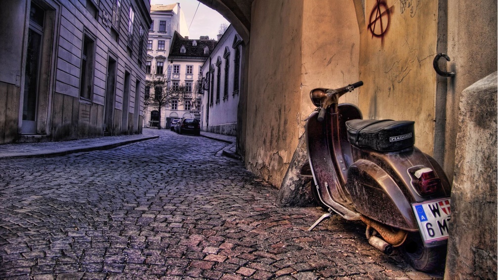 old plaggio scooter in side street in italy hdr